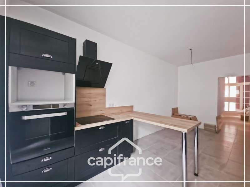 AV immeuble en pierre 300m² centre Puymirol