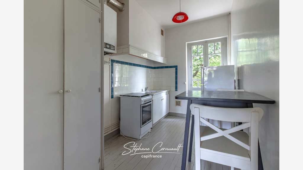 Immeuble de rapport de quatre appartements proche